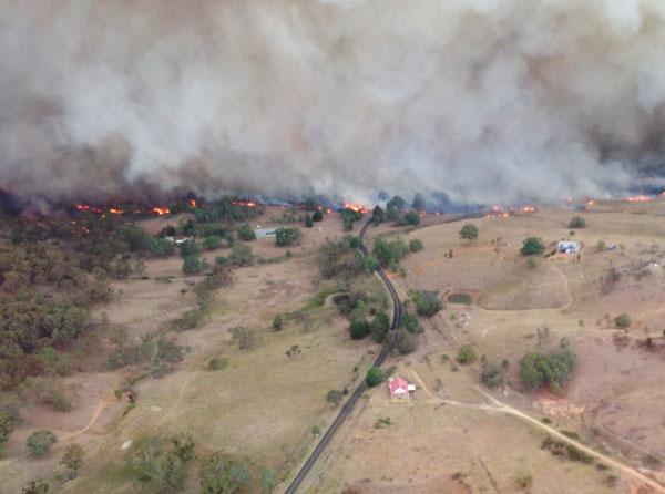A bushfire approaching properties in Coonabarabran, NSW.