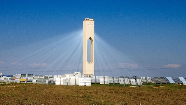 Many mirrors reflecting light onto the solar tower at the PS10 facility in Spain
