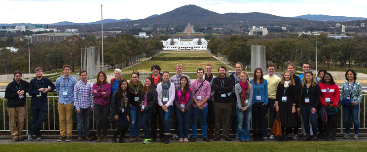 photo of group of participants on roof of parliament house overlooking Canberra