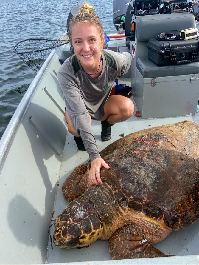 Camille Kynoch with a flatback sea turtle (Natator depressus).