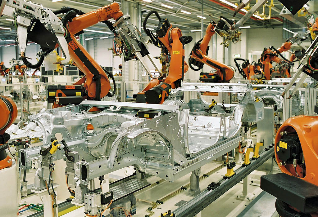 Robotics assembling a car in a factory