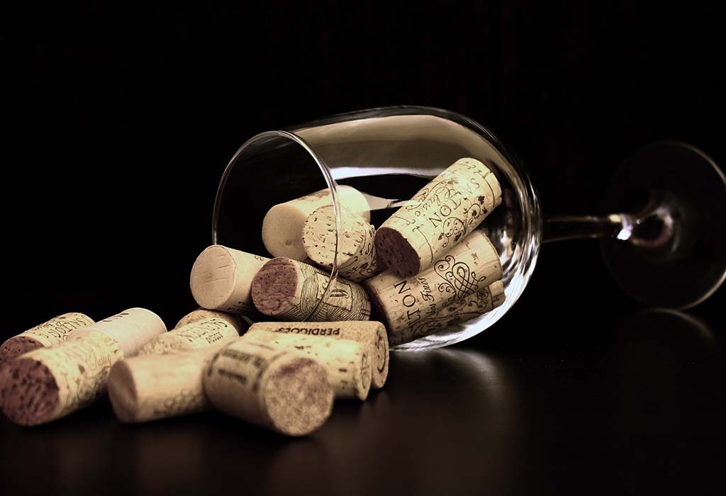 corks spilling out of a wine glass