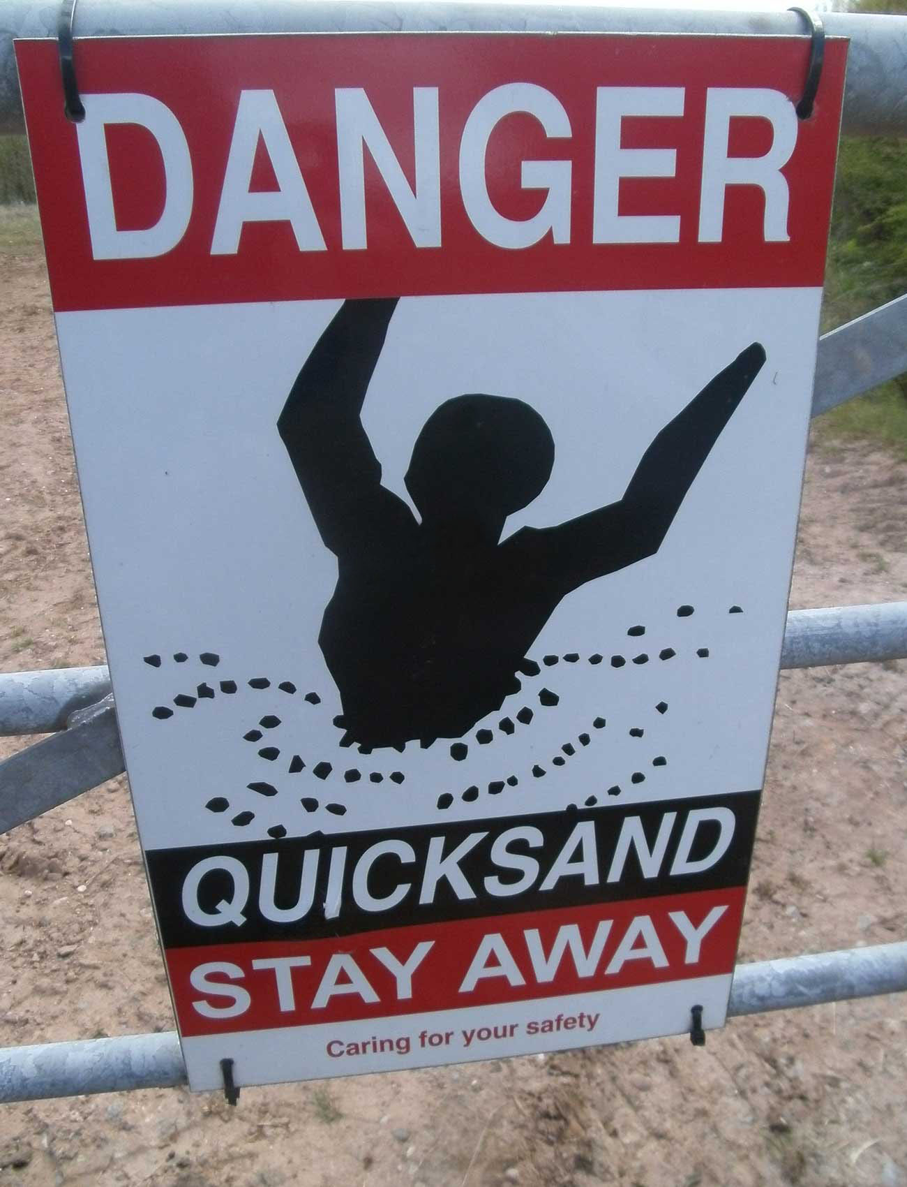 Sign warning people to stay away from quicksand