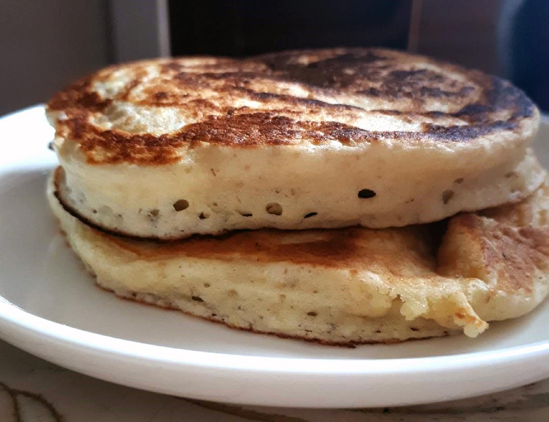 Fluffy pancakes with bubbles visible