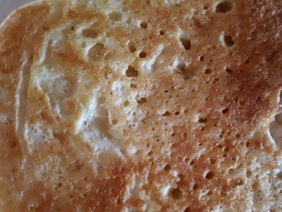 The top golden surface of a pancake