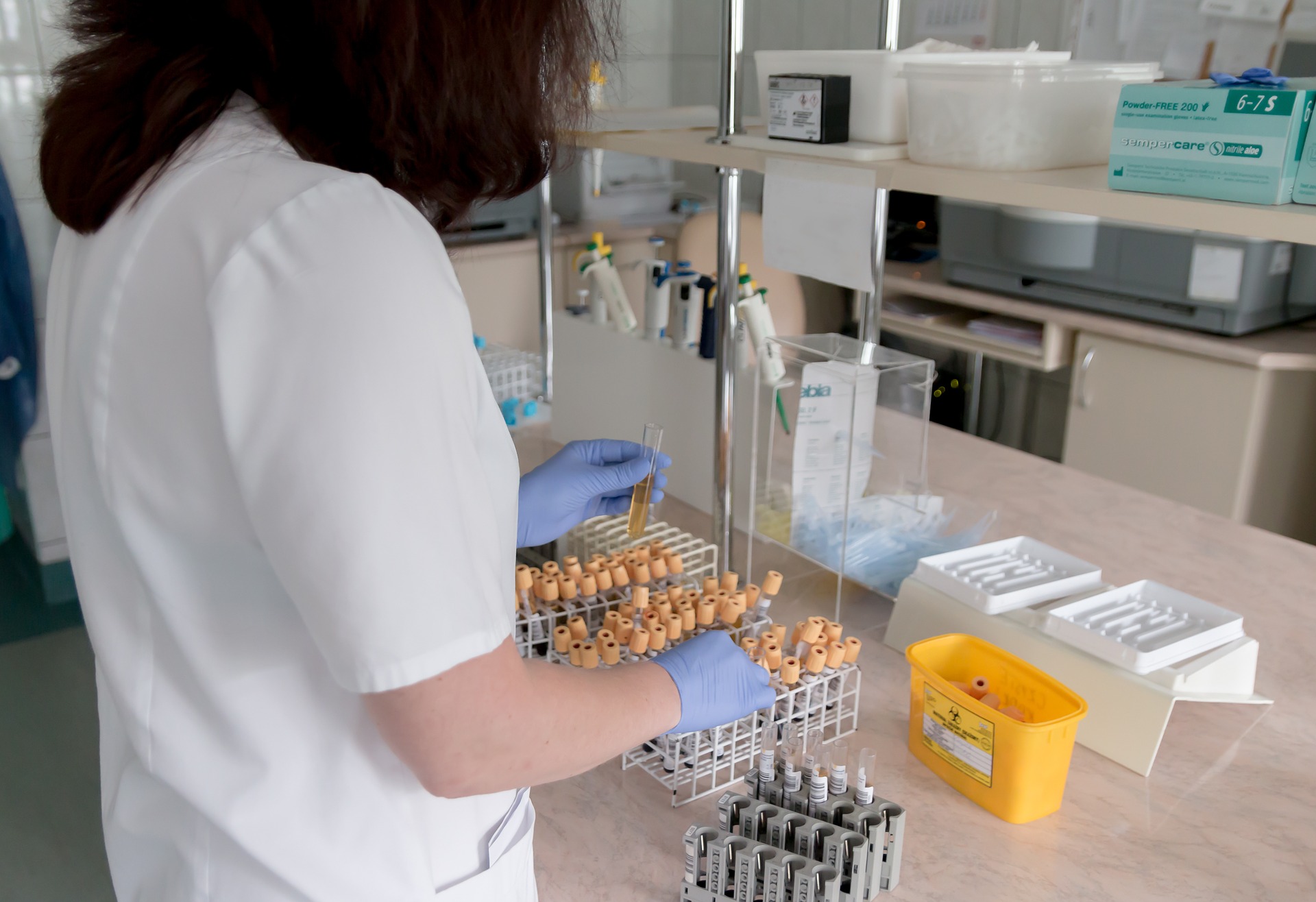 scientist in white lab coat doing science