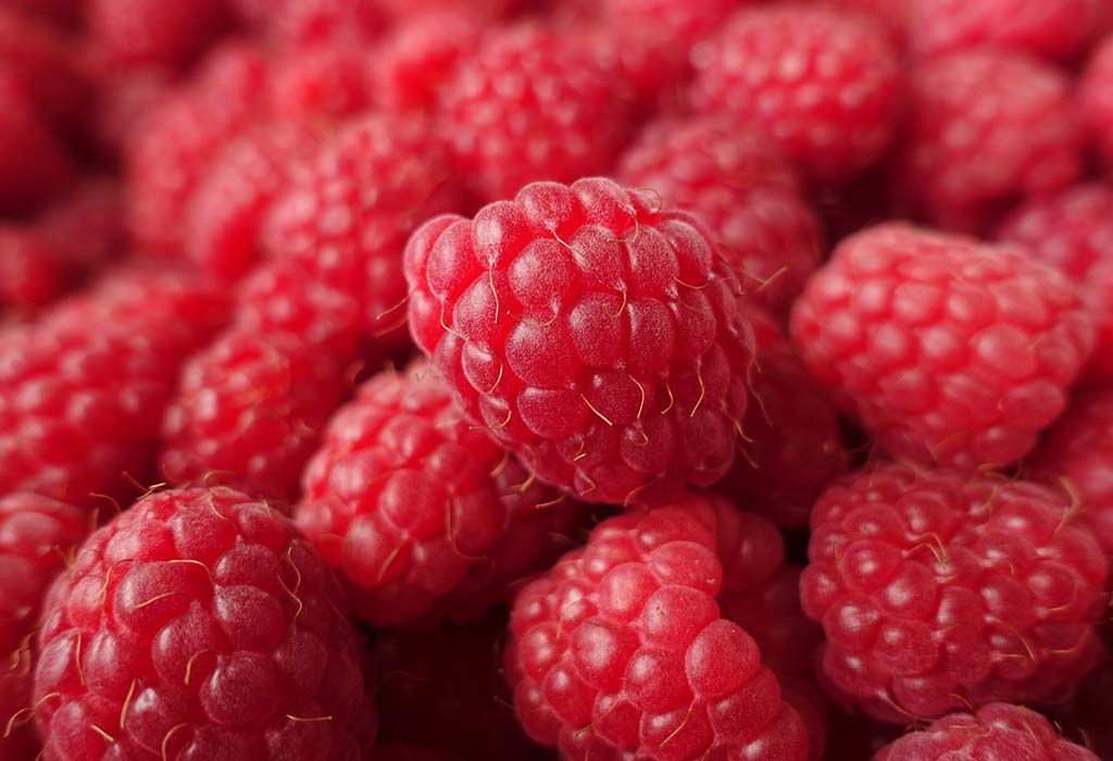 a pile of raspberries