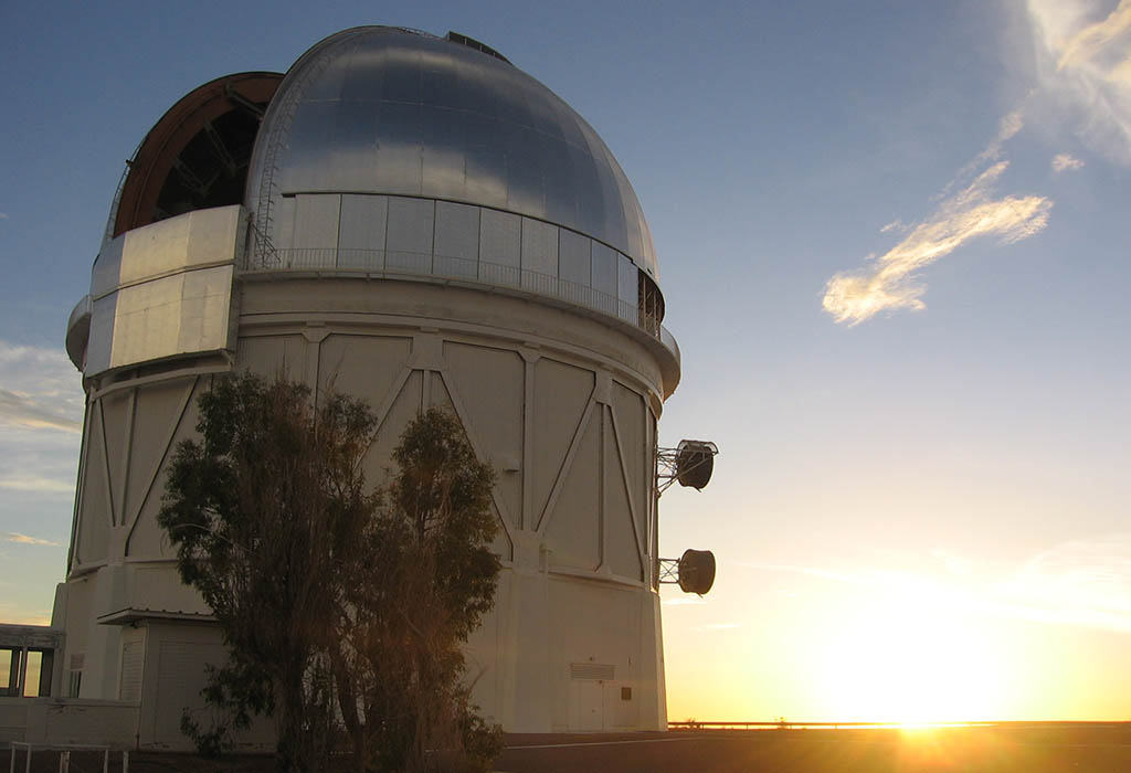 A sunset behind an observatory dome