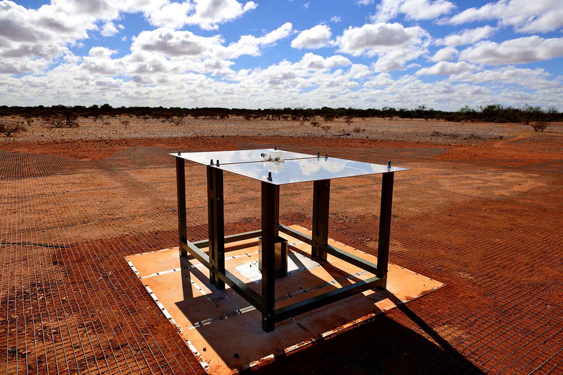 The radio telescope, almost like a square table with a metal top and black legs