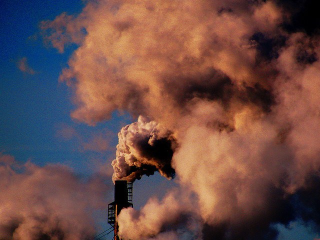 Pollution rising from a smokestack