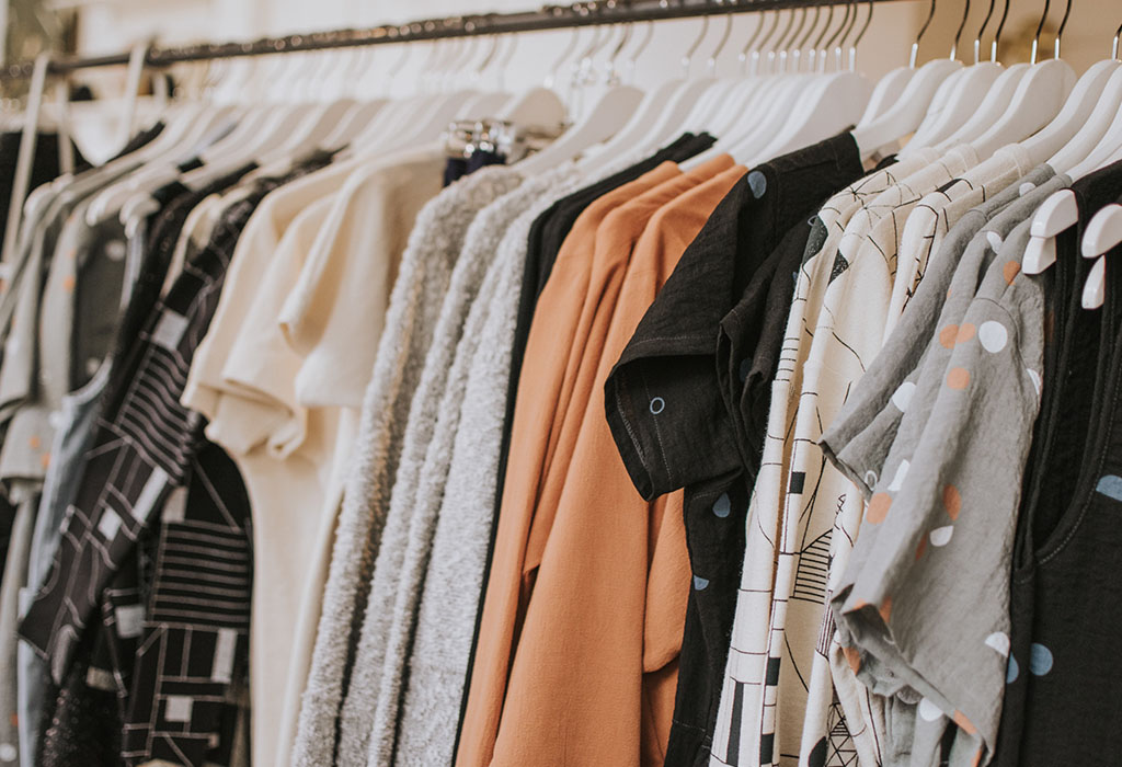 Clothing hanging on a rack in a store