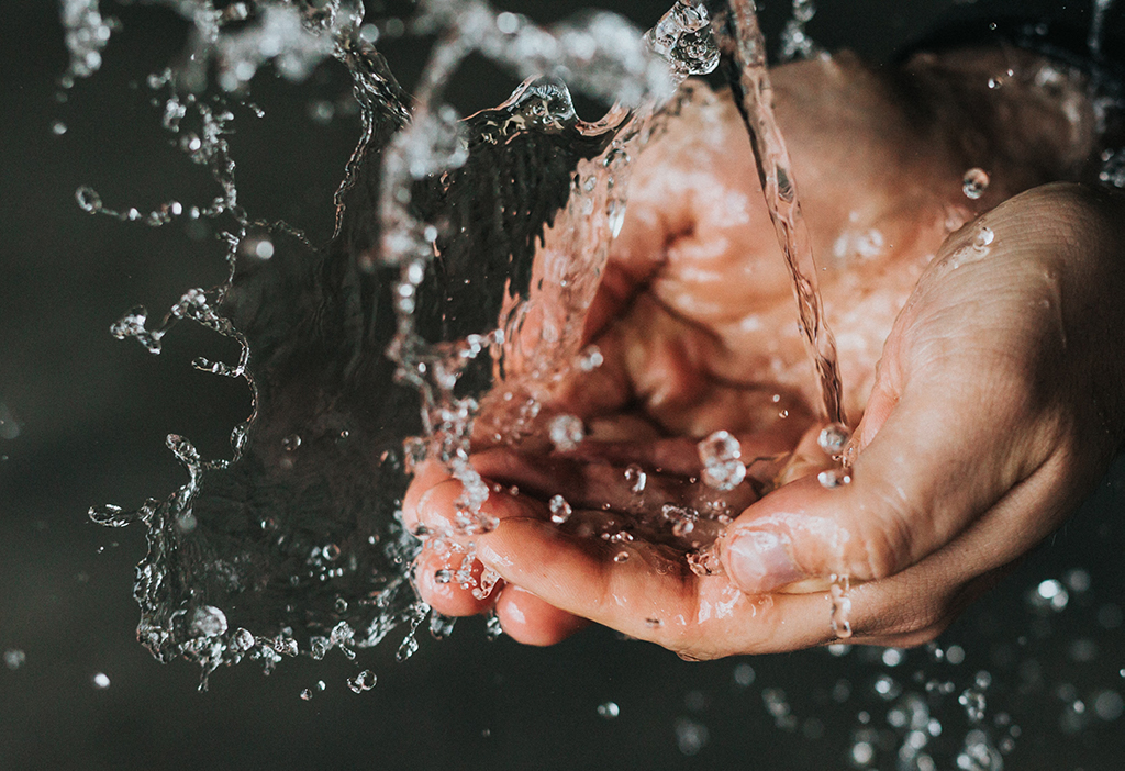 Water splashing on hands