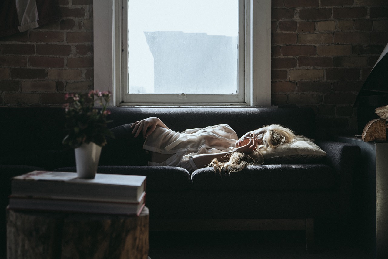 A person sleeping on a couch