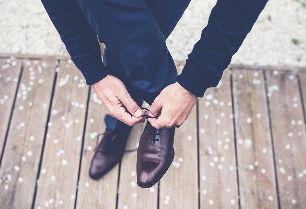 Close up of someone tying shoelaces