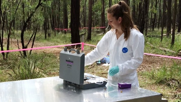 Scientist sampling in the field.