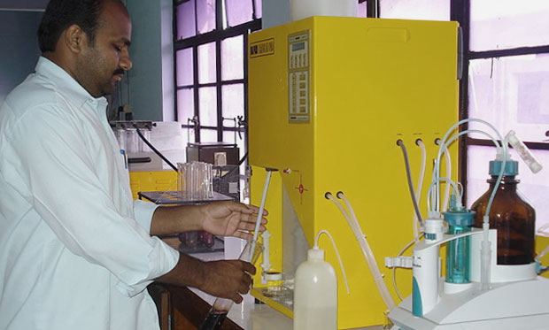 A scientist analysing soil samples.