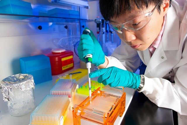 A technician undertaking research in a vaccine design and development lab.
