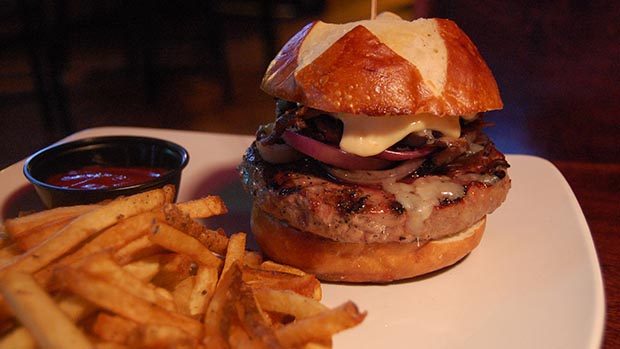 A picture of a burger and chips