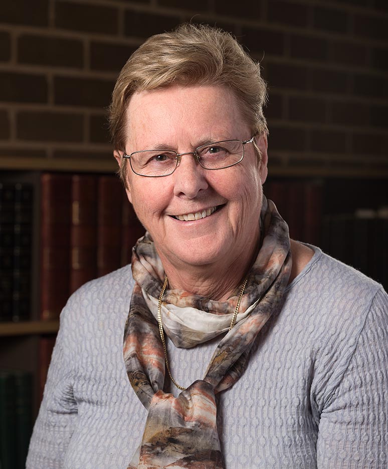 Photographic portrait of a person (Rachel Webster), smiling at the camera.