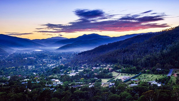 A beautiful view of a town amongst the mountains