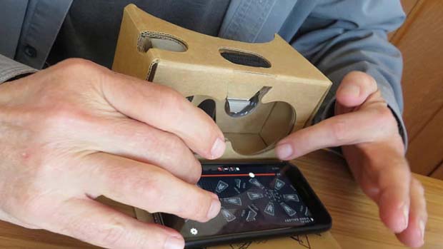 Cardboard headset with smartphone.