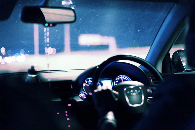 A driver at the wheel at night