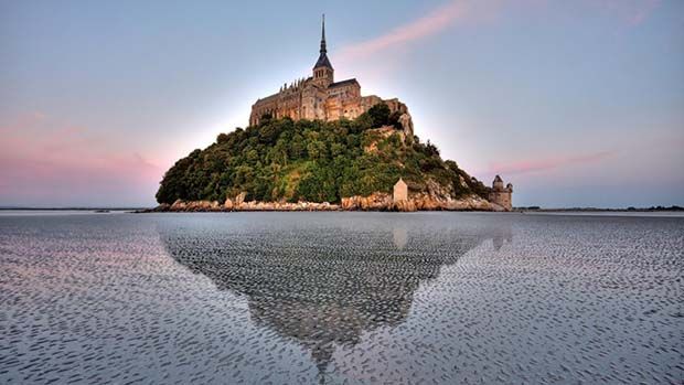 A photograph of Mont. St. Michele during a high tide, when the island is completely cut off from the mainland.