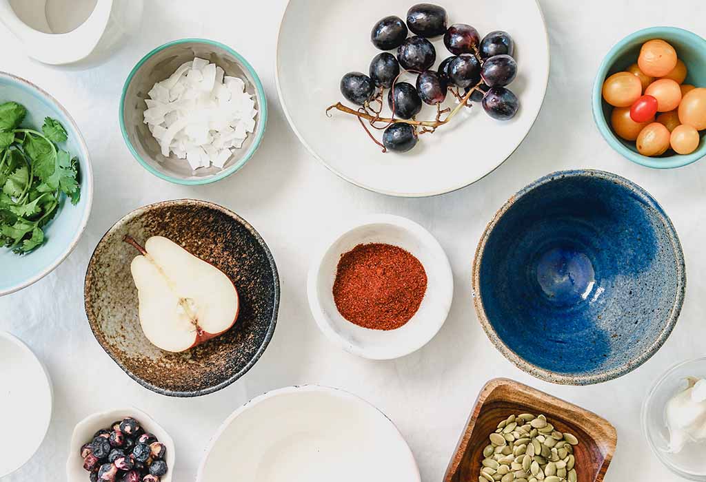 Different foods in small bowls on a table