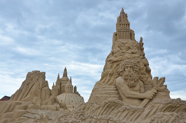 Intricate sand sculptures on a beach 