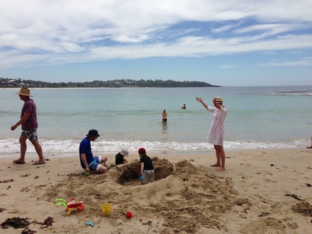 Kids play in the sand on the beach 