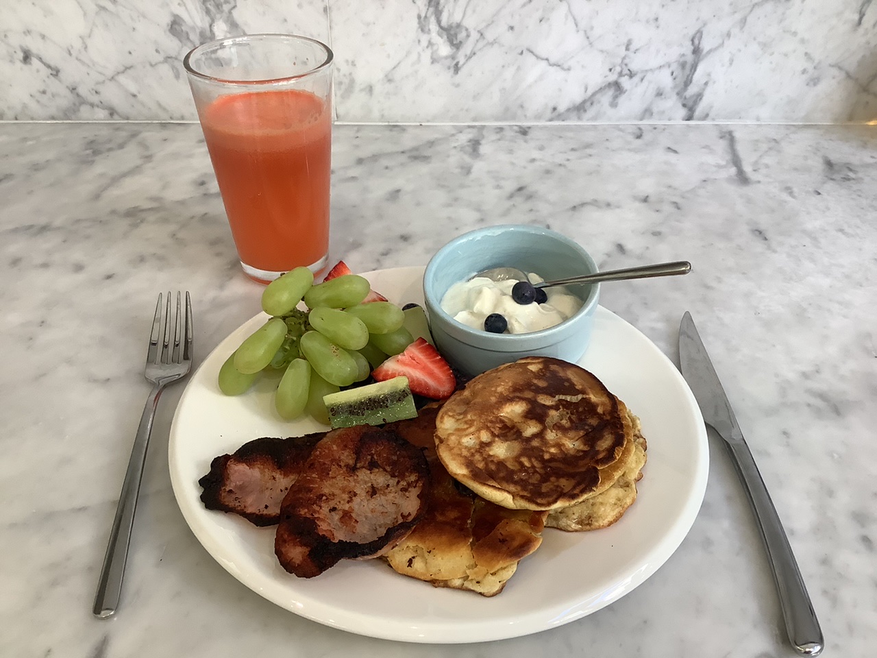 Name: Alexia. Shortlist. I think this breakfast is heathy because it includes all the food groups with fruit, vegetables, grains, protein and dairy and was designed for my growing brother. The plate includes wholemeal pancakes cooked in olive oil, yoghurt, bacon plus fruit including grapes, strawberries, kiwifruit and blueberries. The fresh juice is made from watermelon, orange, carrot and celery. The eggs and bacon provide protein good for muscles, the fruit and vegetables provide vitamins and minerals, the yoghurt provides calcium to help his bones stay strong and the wholemeal flour has fibre good for his digestive system.  He loved it !