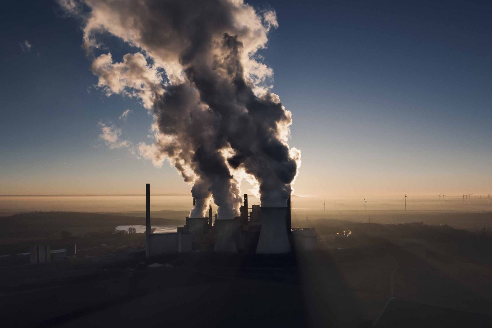 Power station cooling towers releasing steam