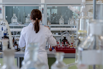 Woman in white coat in laboratory