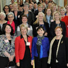 A crowd of women in work attire posing for a photograph at the SAGE launch