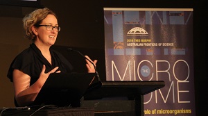 Woman at lectern speaking