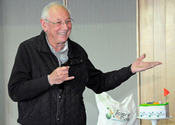 Denis Goodrum smiling and speaking into microphone