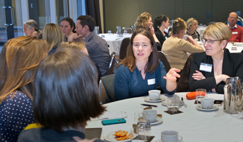 People in discussion, sitting around a table