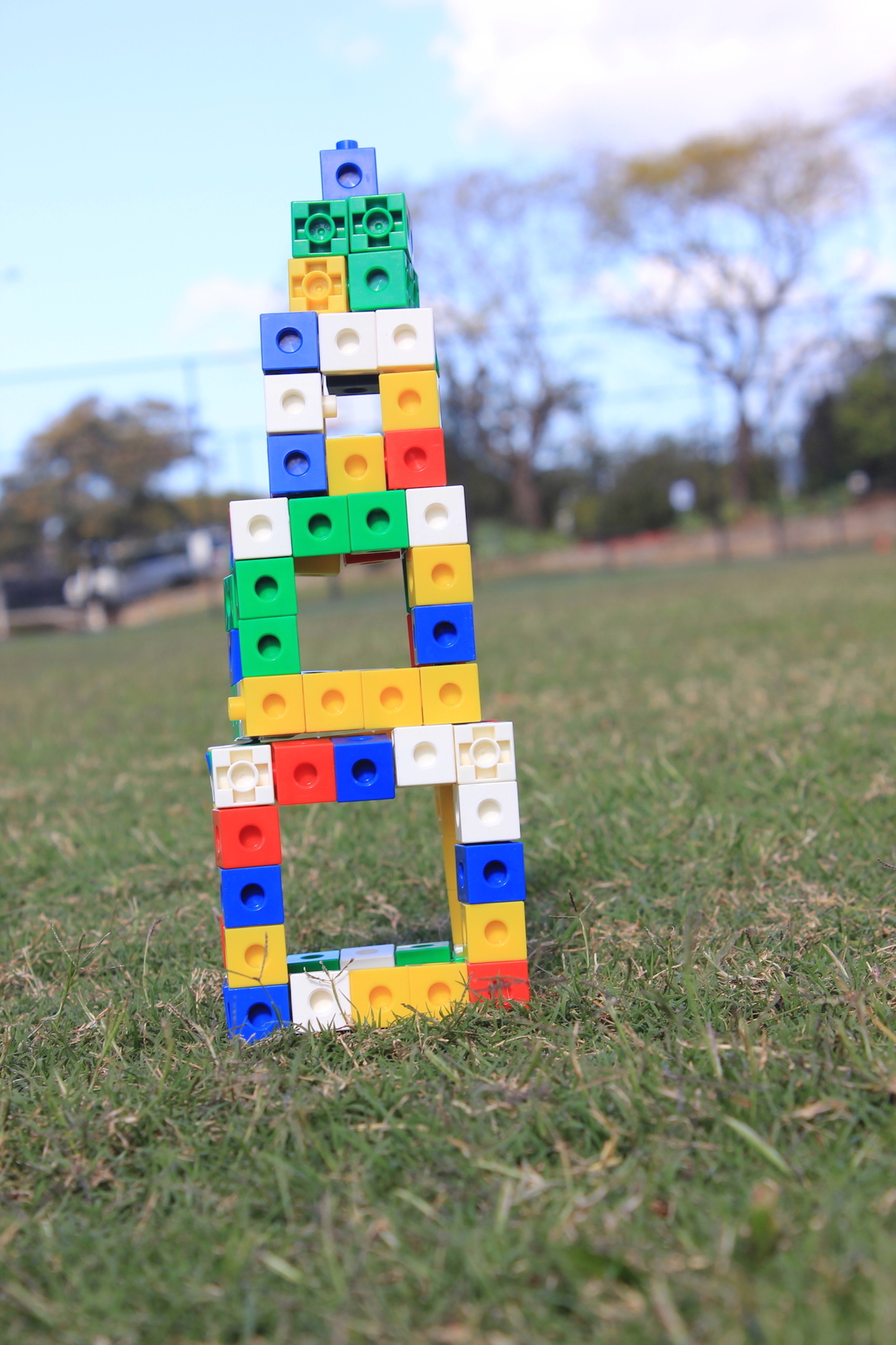 Name: Tang and Sarethaveekul. Prize: Shortlist. It is the tower that is made with blocks. It is from largest to smallest. Its start by 5x5 and getting smaller by 1 dimension each time until it gets into 1x1.  These can shows the areas and perimeter.